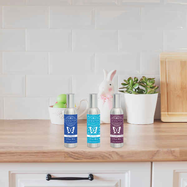 3 Bottles of Scentsy Room Spray on Counter
